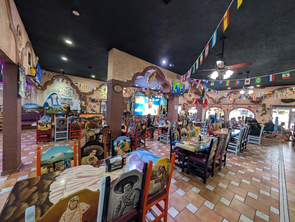 Colorful Mexican restaurant interior with festive décor.